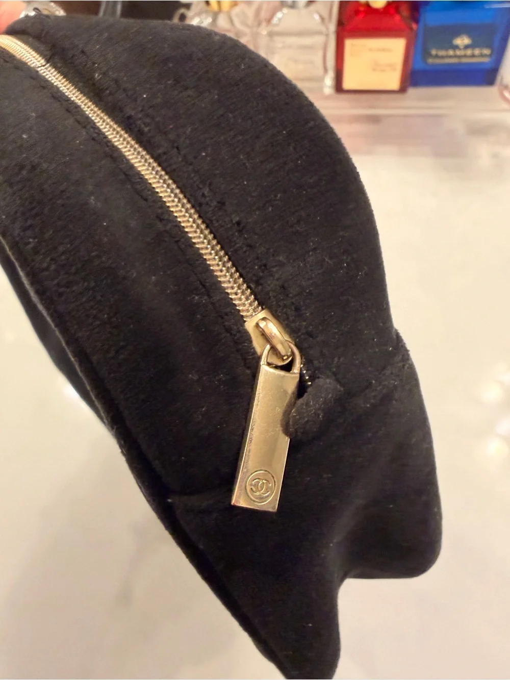 CHANEL Black Suede Cosmetic Pouch with Embossed Logo